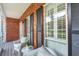 An inviting front porch with comfortable seating, providing an outdoor space for relaxation at 143 Belleplaine Dr, Goose Creek, SC 29445