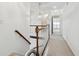 Bright upstairs hallway features decorative light fixture and carpeted floor at 143 Belleplaine Dr, Goose Creek, SC 29445