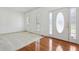 Airy living room with pristine white walls, hardwood floors, and natural light streaming through the windows at 143 Belleplaine Dr, Goose Creek, SC 29445