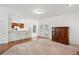 Open-concept living room with kitchen bar seating and hardwood floors at 143 Belleplaine Dr, Goose Creek, SC 29445