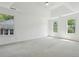 Bright and spacious main bedroom features large windows and tray ceiling at 143 Belleplaine Dr, Goose Creek, SC 29445