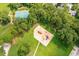 Aerial view of neighborhood playground with sand, colorful play equipment, and trees at 143 Belleplaine Dr, Goose Creek, SC 29445
