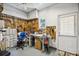 A workshop featuring a pegboard wall covered in tools, a desk, and plenty of storage space at 143 Belleplaine Dr, Goose Creek, SC 29445