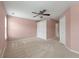 Bright bedroom boasts soft carpet, a ceiling fan, and a double door closet for storage convenience at 1533 Bluewater Way, Charleston, SC 29414