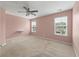 Spacious bedroom features plush carpet, a ceiling fan, and two large windows allowing for ample natural light at 1533 Bluewater Way, Charleston, SC 29414