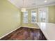 Light-filled dining area with wood floors, modern lighting, and direct access to outdoor area at 1533 Bluewater Way, Charleston, SC 29414