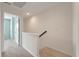 Hallway features neutral walls, carpet flooring and a staircase with a dark wood banister at 1533 Bluewater Way, Charleston, SC 29414