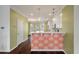 Bright eat-in kitchen area with a decorative half-wall and updated lighting at 1533 Bluewater Way, Charleston, SC 29414