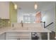 Modern kitchen featuring white countertops, a stainless steel dishwasher, and stylish pendant lighting at 1533 Bluewater Way, Charleston, SC 29414