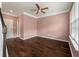 Inviting living room featuring hardwood floors, ceiling fan, natural light, and great space at 1533 Bluewater Way, Charleston, SC 29414