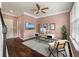 Home office with hardwood floors, natural light, ceiling fan, modern desk, and stylish decor enhance productivity at 1533 Bluewater Way, Charleston, SC 29414