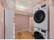 Functional walk-in closet includes hardwood floors, shelving and stacked washer/dryer for added convenience at 1533 Bluewater Way, Charleston, SC 29414