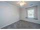 Neutral bedroom with carpeting, ceiling fan, and natural light from window at 1582 Ocean Neighbors Blvd, Charleston, SC 29412