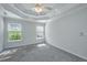 Spacious bedroom with neutral color, carpet, and windows at 1582 Ocean Neighbors Blvd, Charleston, SC 29412