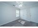 Bedroom with carpet, ceiling fan, closet, and plenty of natural light at 1582 Ocean Neighbors Blvd, Charleston, SC 29412