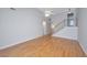 Bright and airy living room features vaulted ceiling, hardwood floors, and staircase at 1582 Ocean Neighbors Blvd, Charleston, SC 29412