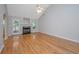 Bright and airy living room with fireplace, hardwood floors, and view to rear porch at 1582 Ocean Neighbors Blvd, Charleston, SC 29412
