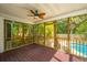 Screened porch with views of backyard and pool at 1582 Ocean Neighbors Blvd, Charleston, SC 29412