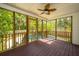 Screened porch overlooking the pool and backyard with ceiling fan at 1582 Ocean Neighbors Blvd, Charleston, SC 29412