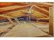 Spacious attic featuring wooden beams, partial flooring, and potential for storage or future expansion at 206 Jimbo Rd, Summerville, SC 29485