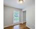 Minimalist bedroom featuring hardwood floors, neutral paint, and a large window at 206 Jimbo Rd, Summerville, SC 29485