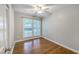 Bright bedroom with a ceiling fan, hardwood floors, and lots of natural light at 206 Jimbo Rd, Summerville, SC 29485
