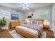 Well-lit bedroom featuring wood floors, ceiling fan, and stylish decor at 206 Jimbo Rd, Summerville, SC 29485