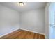 Clean, simple bedroom with hardwood floors and a bright window at 206 Jimbo Rd, Summerville, SC 29485