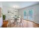Dining area with modern table, chairs, lighting, and French doors at 206 Jimbo Rd, Summerville, SC 29485