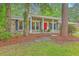 Charming brick home with a bright red front door and a cozy, inviting porch at 206 Jimbo Rd, Summerville, SC 29485