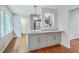 Kitchen island with granite countertop and gray cabinets with stainless steel appliances at 206 Jimbo Rd, Summerville, SC 29485