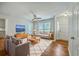 Comfortable living room featuring neutral decor, ceiling fan, plush rug, and large windows at 206 Jimbo Rd, Summerville, SC 29485