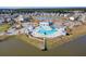 Aerial view of the community's resort-style pool, waterfront access, and well-maintained landscaping at 209 Celestial Blvd, Summerville, SC 29486
