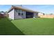 Spacious backyard with lush green grass, a screen porch and privacy fence at 209 Celestial Blvd, Summerville, SC 29486