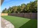 Large backyard featuring a manicured lawn and a wood fence for privacy at 209 Celestial Blvd, Summerville, SC 29486