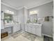 Elegant bathroom with dual vanities, modern lighting, and decorative accents at 209 Celestial Blvd, Summerville, SC 29486