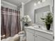 Well-lit bathroom featuring tub and shower combination, vanity, and stylish decor at 209 Celestial Blvd, Summerville, SC 29486