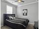 Bedroom featuring neutral walls, dark furnishings, and a large window with white shutters at 209 Celestial Blvd, Summerville, SC 29486