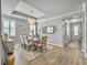 This formal dining room features modern lighting, hardwood floors and large windows at 209 Celestial Blvd, Summerville, SC 29486