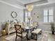 Charming dining room with modern chandelier and a light grey color palette at 209 Celestial Blvd, Summerville, SC 29486