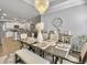 Charming dining room with modern chandelier and an open concept layout to the kitchen at 209 Celestial Blvd, Summerville, SC 29486