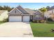 Charming single-Gathering home featuring a two-car garage, manicured lawn, and beautiful brick and siding details at 209 Celestial Blvd, Summerville, SC 29486