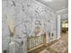 Bright foyer features a marble accent wall, elegant decor, and hardwood flooring at 209 Celestial Blvd, Summerville, SC 29486