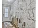 Bright foyer features a marble accent wall, elegant decor, and hardwood flooring at 209 Celestial Blvd, Summerville, SC 29486