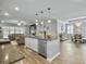 Open kitchen featuring granite countertops and views into dining and living areas at 209 Celestial Blvd, Summerville, SC 29486