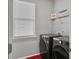 Bright laundry room featuring modern washer and dryer with shelving at 209 Celestial Blvd, Summerville, SC 29486