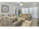 Spacious living room featuring hardwood floors, a ceiling fan and neutral paint at 209 Celestial Blvd, Summerville, SC 29486