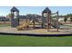 Community playground with slides, climbing wall, and wooden structure surrounded by lush greenery and neighborhood homes at 209 Celestial Blvd, Summerville, SC 29486