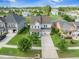 Charming home with a manicured lawn, two-car garage, inviting porch, and neighborhood amenities including a lake and pool at 246 Calm Water Way, Summerville, SC 29486