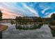Scenic aerial view showcasing a tree-lined peninsula extending into a calm lake, with a community nestled in the background at 246 Calm Water Way, Summerville, SC 29486